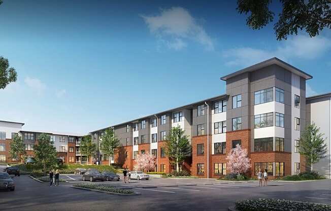 A modern apartment complex with multiple buildings and a parking lot in front.