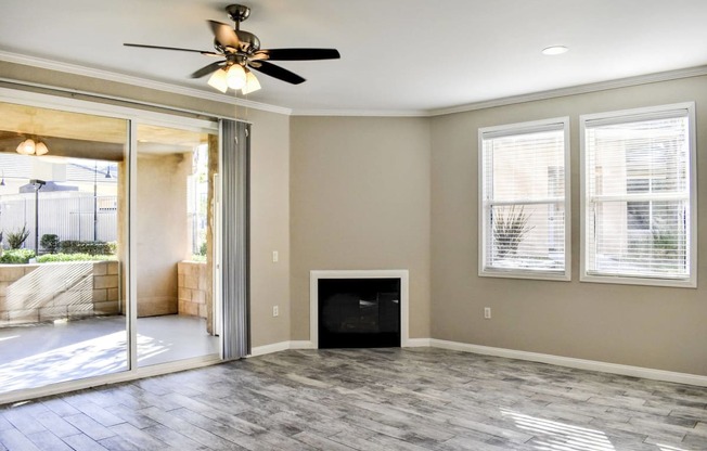 Living room with fireplace and plank wood flooring