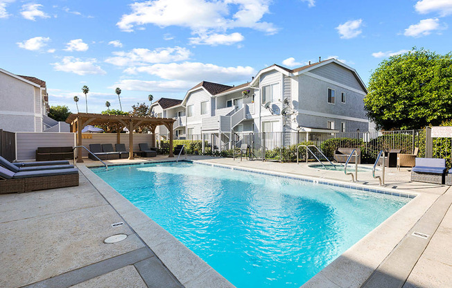 Large courtyard swimming pool, including jacuzzi and lounging area.