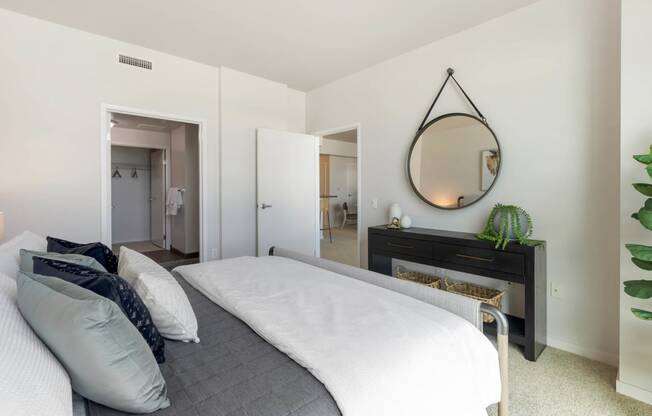 a bedroom with a bed and a mirror above it  at Vue, San Pedro, 90731