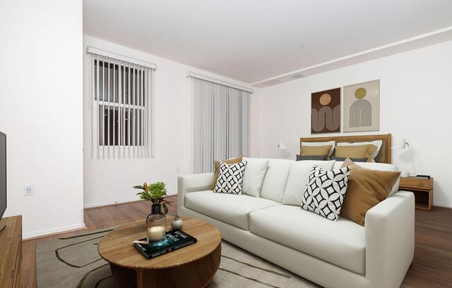 a living room filled with furniture and a flat screen tv