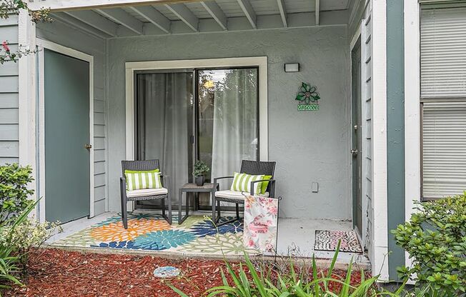 model patio with two chairs and a small table