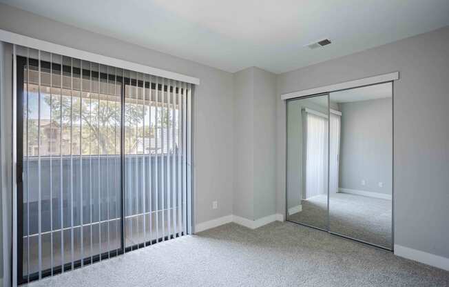 the master bedroom has sliding glass doors to the patio