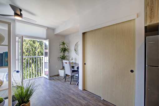 A room with a desk and a chair in it.