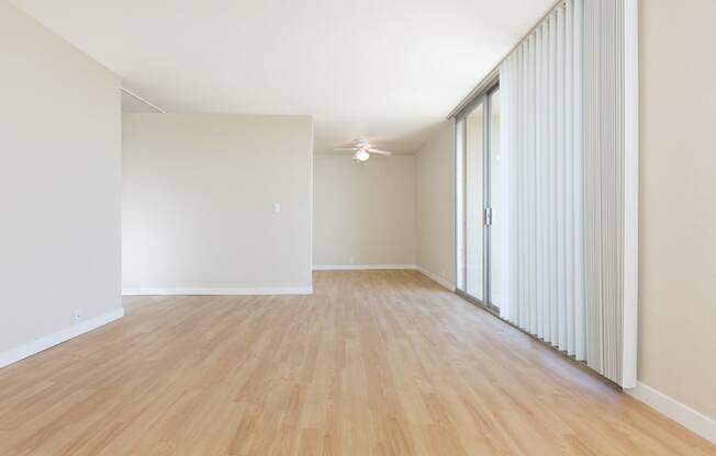 edgewood unfurnished living room with wood plank style flooring at Avenue Two Apartments, Redwood City  , California