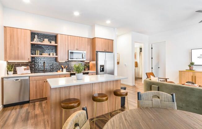 Thoughtful design meets everyday comfort in these airy, open kitchens at Modera Higley Commons.