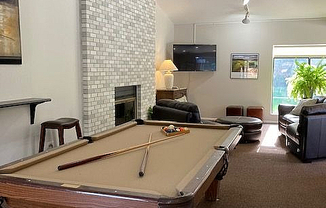 Experience the perfect blend of relaxation and entertainment in this inviting lounge space.
