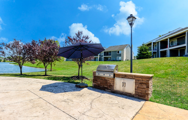 Outdoor grill station at Somerset Lakes Apartments, featuring a built-in grill.