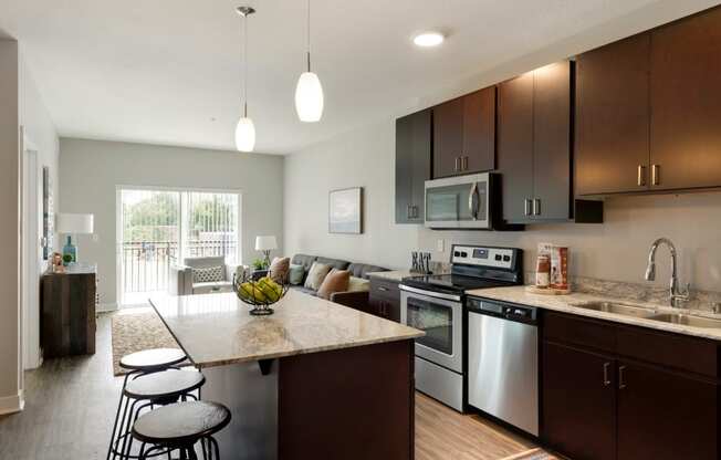 Kitchen and living w/balcony at The Liberty Townhomes in Golden Valley, 55427