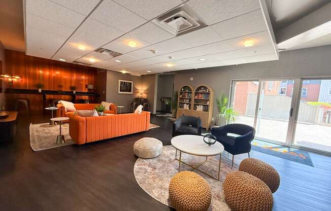 A living room with a sofa, chairs, and a coffee table.