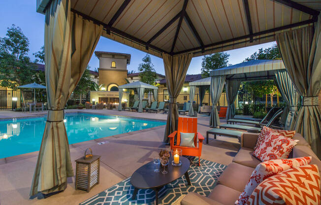 resident pool at night with cabana seating at Capriana at Chino Hills, Chino Hills, CA, 91709