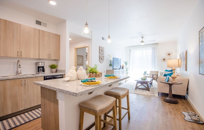 an open floor plan with a kitchen and living room