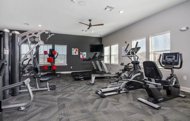 fitness center with cardio equipment and weight machines