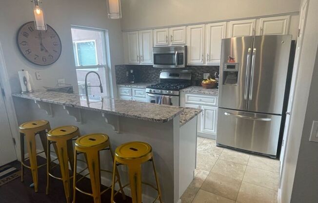 LOCATION!  Newer contemporary townhome 2 bed w/office space in Denver's desirable Berkeley neighborhood across from lake & park!