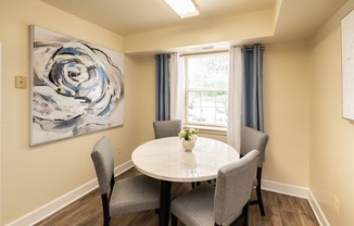 Eat-in dining area with a table and chairs with window in Randallstown, MD