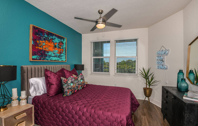 Designer bedroom with city views at The Exchange Luxury Apartments in St. Petersburg, FL