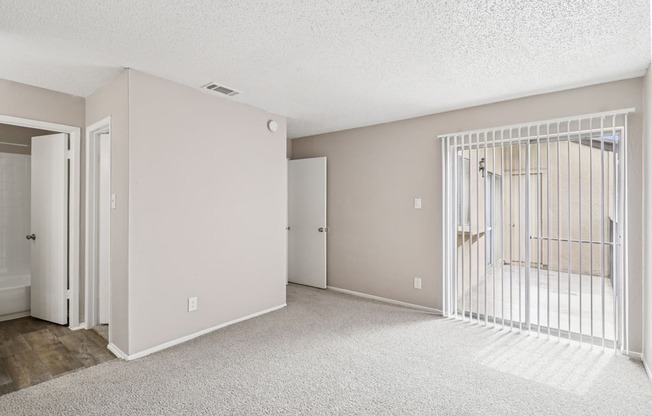 B6 room with a white carpet and a white gate.