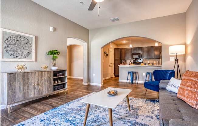 A living room with couch, table, and cabinets at the Flats at Sundown in North Port, Florida