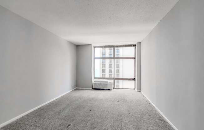 an empty room with a large window