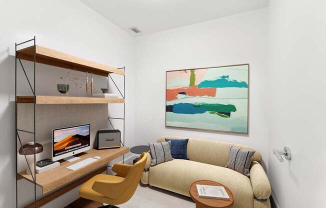 A room with a yellow chair and a couch with a painting on the wall.