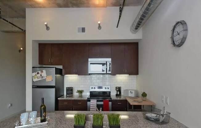 a kitchen with stainless steel appliances and a counter top