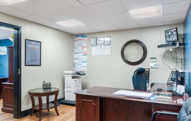 an office with a wooden desk and a chair