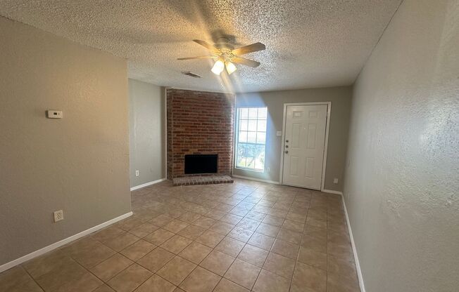 Two story unit with fireplace and backyard!