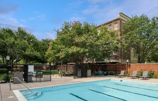 our apartments have a swimming pool and a patio with chairs