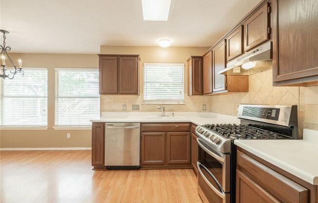 No Carpet! Tons of Space! Beautiful backyard with large covered patio!