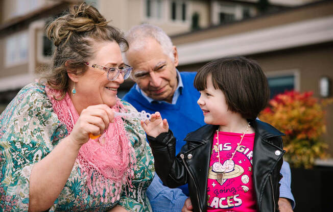 a little girl and her grandparents eating ice cream  at Harbor Heights 55+ Community, Olympia