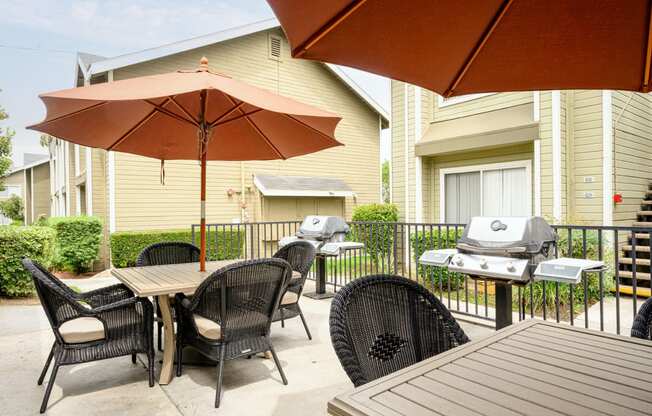 the reserve at bucklin hill patio with tables and chairs and a grill at Sagewood Gardens Senior Apartments, Hacienda Heights, CA