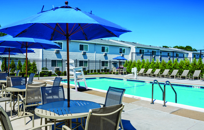 outdoor pool with sunbrellas at Southwood Luxury Apartments, New York