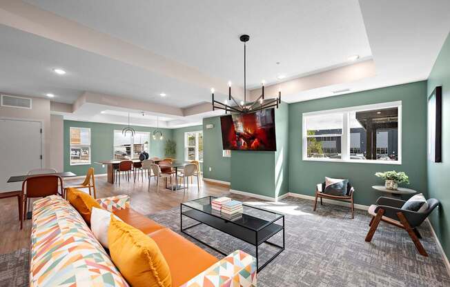 A living room with a sofa, chairs, and a coffee table.