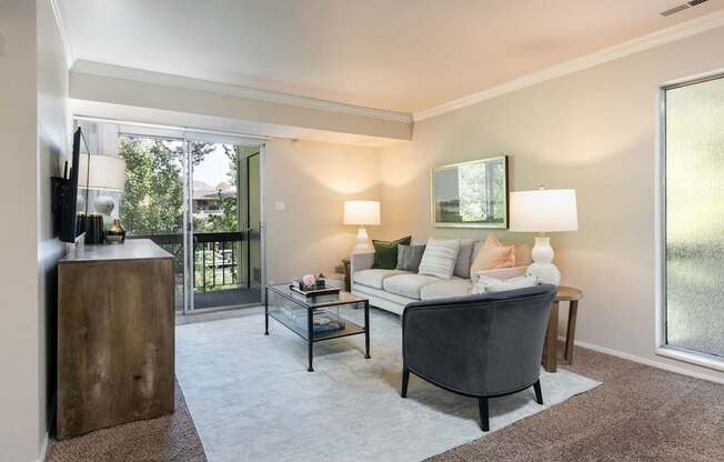 a living room with a couch and a chair