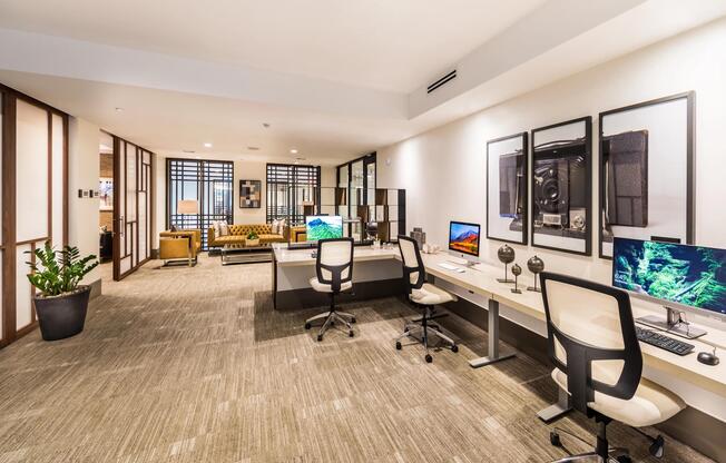 Business center with work stations and a coworking lounge for focused productivity.
