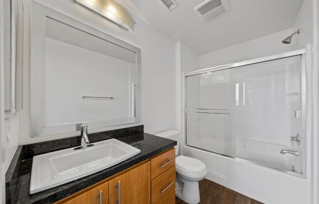 the preserve at ballantyne commons apartment bathroom with sink toilet and shower