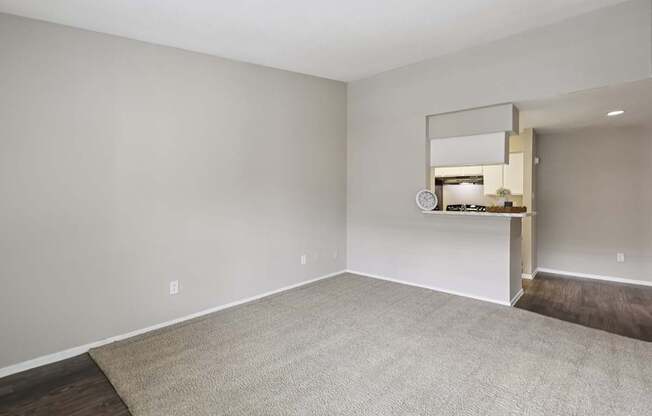 A small kitchenette with a white countertop and a small fridge.