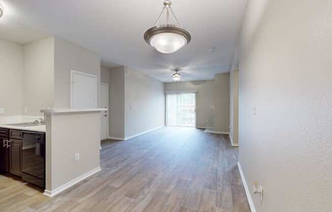 an empty room with rainbow colored lights on the floor