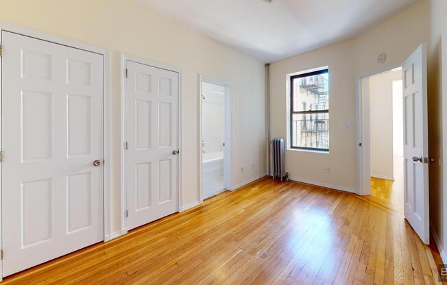201 205 W 11 ST