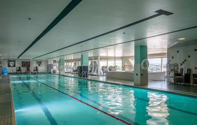 a swimming pool in a gym with a blue water at The Lucy Boise Apartments, Boise