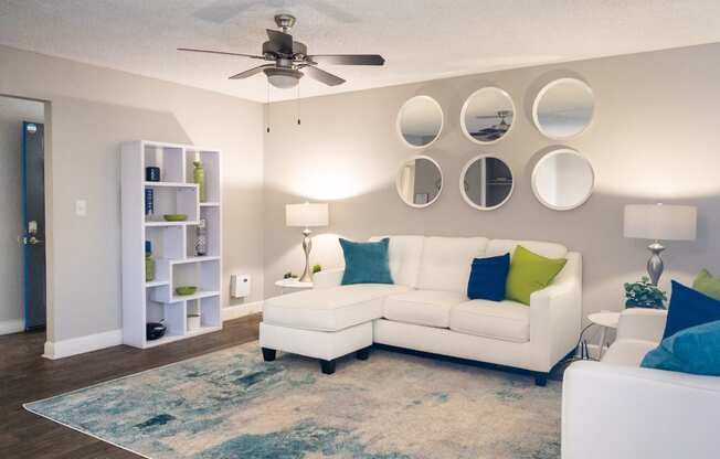 a living room with a white couch and a ceiling fan at Granite Bay, Phoenix, Arizona, 85023