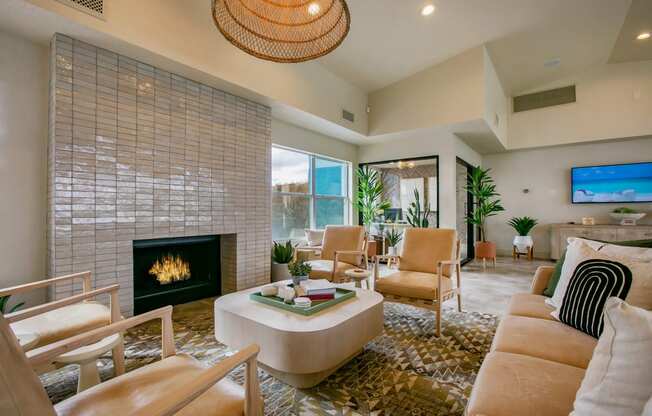 a living room with a fireplace and a large window