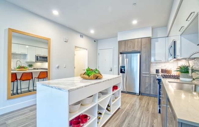 spacious kitchen with an island at Aya Apartments