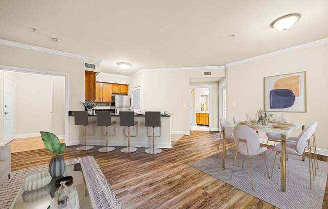 A modern kitchen with a dining table set up.