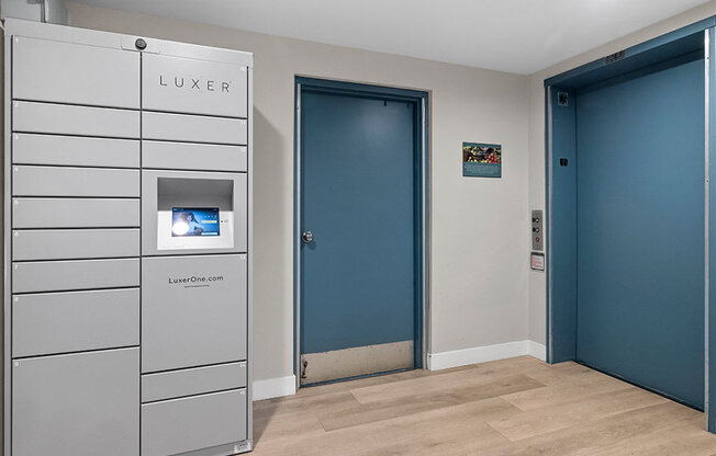 Secure package delivery lockers in elevator vestibule.