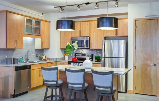 Kitchen with dinning table at Arcade Apartments, Missouri