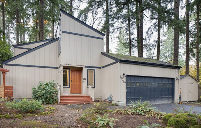 Check Out This Beautiful Home Nestled In The Trees That Sits On A Huge Lot In Lake Oswego!