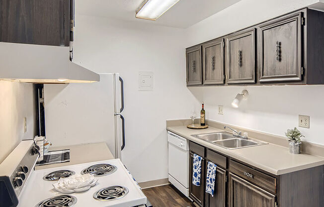 kitchen with dishwasher, oven, and refrigerator