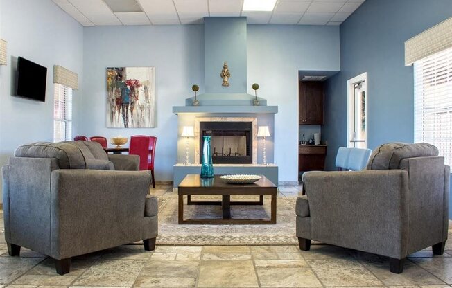 Clubhouse Lounge with Fireplace with Armchairs and Coffee Table