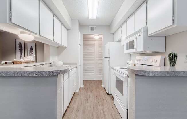 galley-style fully equipped kitchen  at Country Square, Texas, 75006